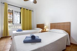 Postel nebo postele na pokoji v ubytování Casa Carlos