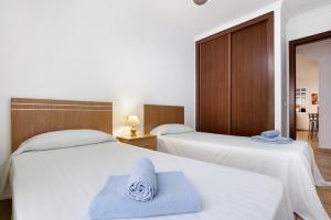 Postel nebo postele na pokoji v ubytování Casa Carlos