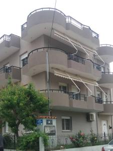 a large building with balconies on the side of it at Evelins house Alexandroupoli in Alexandroupoli
