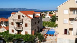 a view of a building and a swimming pool at Villa Ana in Bol