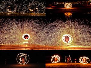 a fire show with a person in a circle of sparks at Kacha Resort & Spa, Koh Chang in Ko Chang