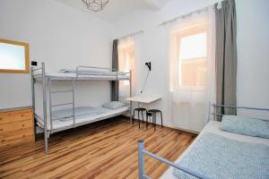 Posteľ alebo postele v izbe v ubytovaní Hostel Cinnamon