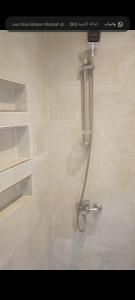a shower in a bathroom with a shower head at ميراج باى in Safaga