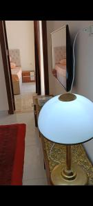 a white table in a room with two beds at ميراج باى in Safaga