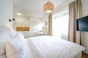 Posteľ alebo postele v izbe v ubytovaní Urban Apartments by Homester + 29 fotografií