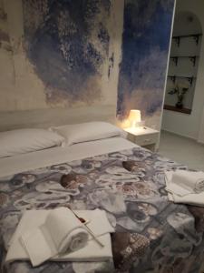 Posteľ alebo postele v izbe v ubytovaní Il Centenario