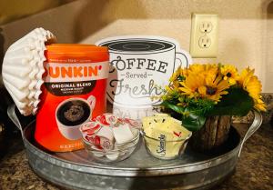 a metal tray with coffee items and flowers on a counter at The Barn in Asheville +6 photos