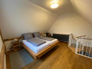 a bedroom with a bed in a attic at Ferienwohnungen Etzl in Bad Mergentheim