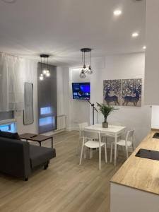A television and/or entertainment centre at Bravo Murillo Apartments