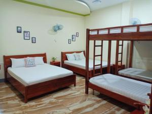 Postel nebo postele na pokoji v ubytování Đức Chính Hotel - Ninh Chu - Phan Rang