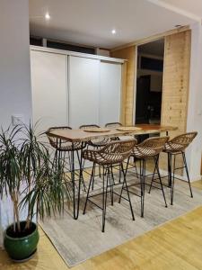 a dining room with a table and chairs at Appartement 65 m² proche pistes in Bolquere Pyrenees 2000