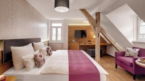 Postel nebo postele na pokoji v ubytování Alpen Hotel München + 25 fotografií