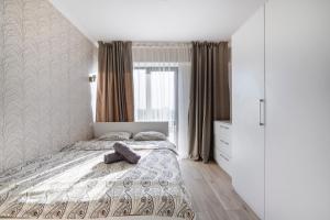 Cama o camas de una habitación en Бизнес и отдых