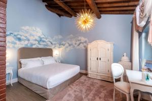 A bed or beds in a room at Castrum Wine Relais