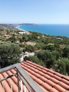 a view of the ocean from the balcony of a house at Fascino del Cilento - Appartamenti in Caprioli