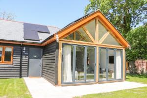 an extension to a house with sliding glass doors at Robins Nest in Fareham