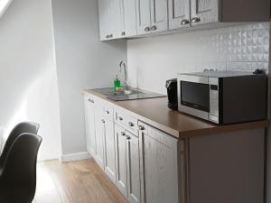 Kuchyň nebo kuchyňský kout v ubytování TWOJA CHATA Apartamenty pod niebem zarezerwuj na podhalami pl
