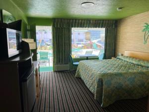 Postel nebo postele na pokoji v ubytování Caribbean Motel