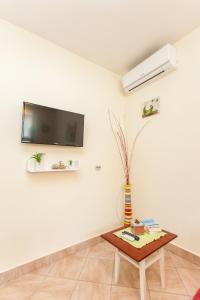 TV a/nebo společenská místnost v ubytování Nena City Center Apartment