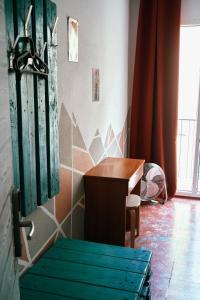 a room with a desk and a table and a window at LOFT APART & HOSTAL Group in Lloret de Mar