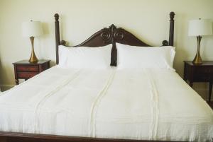 A bed or beds in a room at Bellview Luxury Suites