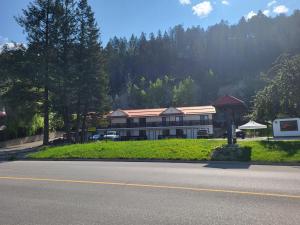 a large building on the side of a road at Alpen Motel in Radium Hot Springs