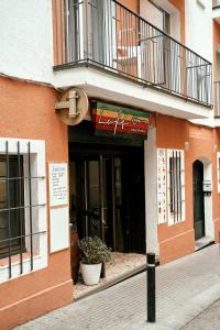 a building with a sign on the front of it at LOFT APART & HOSTAL Group in Lloret de Mar