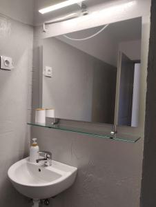 a bathroom with a sink and a mirror at el castle in Agioi Apostoli