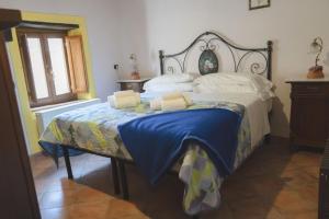 Postel nebo postele na pokoji v ubytování Borgo Giusto Tuscany
