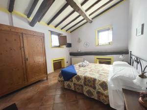 Postel nebo postele na pokoji v ubytování Borgo Giusto Tuscany