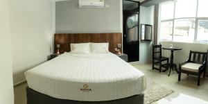 Ένα ή περισσότερα κρεβάτια σε δωμάτιο στο GOYA HOTEL