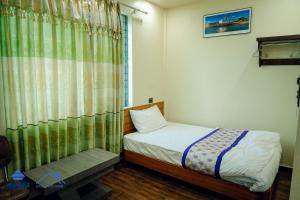 Postel nebo postele na pokoji v ubytování Hotel Happy Home