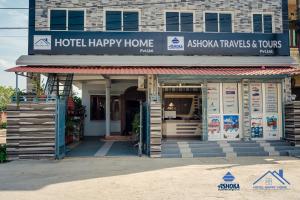 a hotel happy home with a sign on it at Hotel Happy Home in Bhairāhawā
