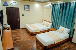 Postel nebo postele na pokoji v ubytování Hotel Happy Home