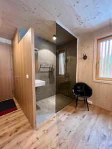 a room with a sink and a chair in a room at Apartment Eiler - Mellau in Mellau