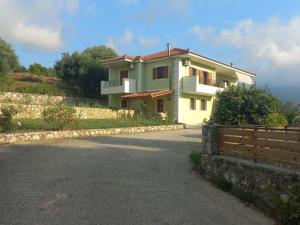 a house on the side of a road at Dimitris Hidden Paradise - Three bedroom apartment 