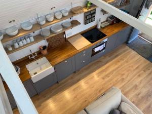an overhead view of a kitchen in a tiny house at The Coach House in Shootend