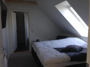 Postel nebo postele na pokoji v ubytování Kærskovgård ferielejligheder