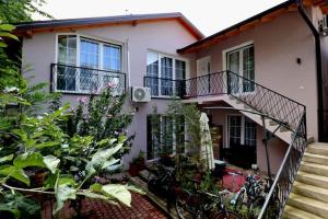 a house with bikes parked in front of it at Mati Apartments Prishtina in Pristina