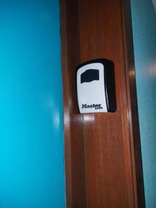 a door with a toaster sign on it at Le Studio Zen "parking gratuit" in Cherbourg en Cotentin