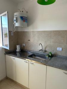 a kitchen with a sink and a counter top at Aires del estero 2 in Santiago del Estero