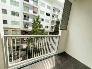a balcony with a view of a building at Cozy living at Sukhumvit 77 BTS Onnut, Bangkok City in Amphoe Phra Khanong