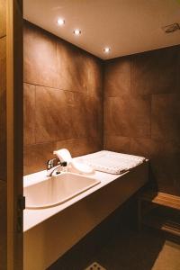 a bathroom with a sink and a counter at DOMO CAMP Sylt - Glamping Camp in Westerwall