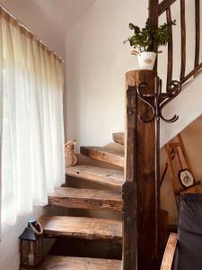 a set of stairs with a potted plant on top at Inside, The Village- Atelier 