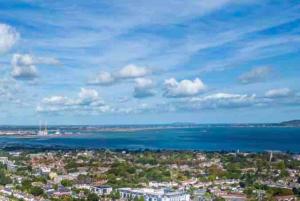 an aerial view of a city and the ocean at Luxury Seaview Apartment in Dublin