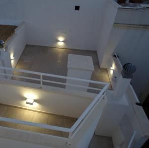 an overhead view of a room with stairs and lights at Cinque terrazze - Casa d'epoca con vista mare in Gallipoli