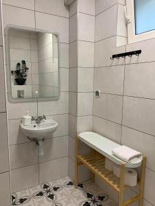 a white bathroom with a sink and a mirror at Dom na Północy in Władysławowo +42 photos
