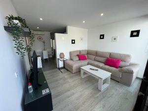 a living room with a couch and a table at Can Sastre in El Port