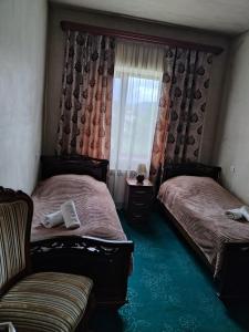 Ein Bett oder Betten in einem Zimmer der Unterkunft Garni Guesthouse
