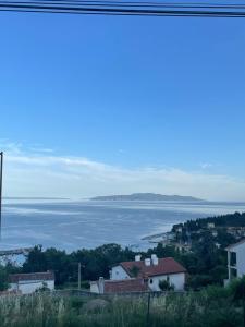 a view of the ocean from a town at Studio Apartman Lana 3 in Ičići
